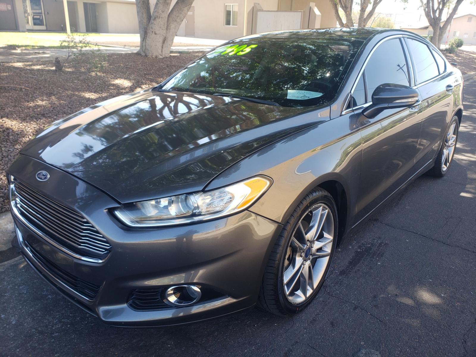 2016 /gray and black Ford Fusion titanium (3FA6P0K99GR) with an 2.0L L4 DOHC 16V engine, 4-Speed Automatic transmission, located at 323 E Dunlap Ave., Phoenix, AZ, 85020, (602) 331-9000, 33.567677, -112.069000 - Photo #0